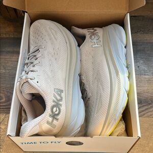 Hoka Light Gray Running Shoes with Yellow Accents